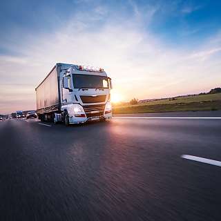 truck on road sunset