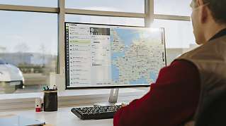 Fleet manager behind screens for managing fleet