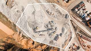 Construction area with vehicles and equipment viewed from above