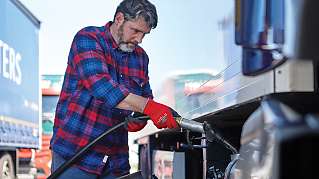 Truck driver at a gas station