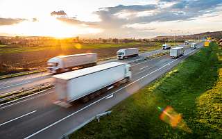 trucks on the road sunset