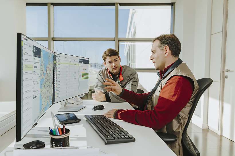 Fleet manager coaches a driver on driving techniques that save fuel