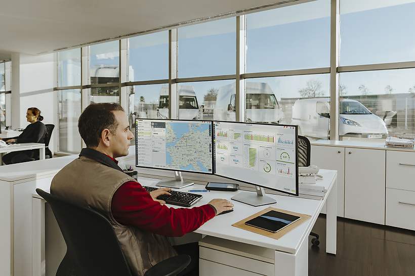 A South African fleet manager monitoring driver's licence and PrDP compliance data using telematics software in an office