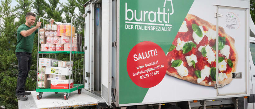 A Buratti delivery worker loads a Buratti truck